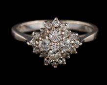 An 18ct white gold and diamond circular cluster ring: set with round brilliant-cut diamonds,