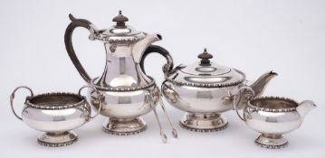 An Elizabeth II silver four-piece tea service, maker Walker & Hall, Sheffield,