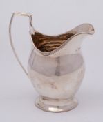 A George III silver helmet shaped cream jug, maker I.