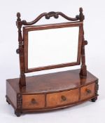 A late Regency mahogany swing frame platform toilet mirror: the rectangular plate with scroll and