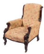 A Victorian carved mahogany armchair:, with upholstered scroll back,