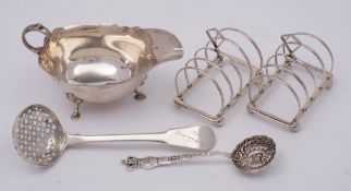 A mixed lot of silver wares: including a pair of George V silver four-division toast racks,
