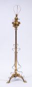 An Edwardian brass telescopic standard oil lamp:, adapted for electric light,