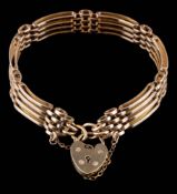 A 9ct gold four-bar gate-link bracelet: with 9ct gold heart-shaped clasp approximately 20gms gross