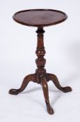 An 18th Century fruitwood circular occasional table:,