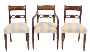 A set of eight Regency mahogany dining chairs:,
