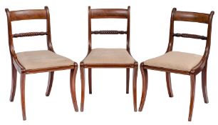 A set of six Regency mahogany and brass strung dining chairs:,