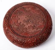 A Chinese carved cinnabar lacquer box and cover: of circular form,