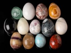 A Blue John hardstone egg: 7cm long, together with twelve other polished hardstone eggs, (13).