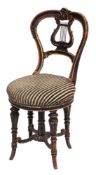A 19th Century French ebonised and gilt decorated revolving piano chair:,