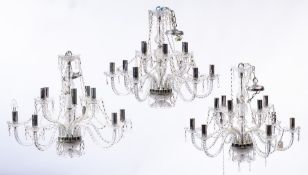 A set of three glass two tier graduated twelve branch chandeliers:,