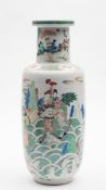 A Chinese famille verte 'Tribute Bearers' rouleau vase: painted overall with figures holding