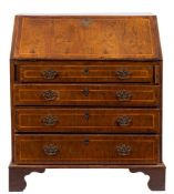 An early 18th Century walnut and cross and feather banded bureau:,