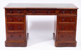 A Victorian mahogany pedestal desk:, of recessed breakfront outline,