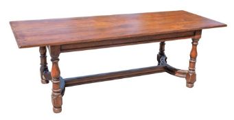 An oak dining table of refectory type in the 17th Century style:,