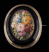 An oval mosaic brooch of floral design: approximately 46mm long, 18gms gross weight,