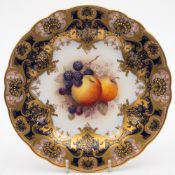 A Royal Worcester fruit painted cabinet plate by William Ricketts: the centre painted with peaches,