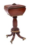 A late Regency mahogany and brass mounted teapoy:, of sarcophagus shape,