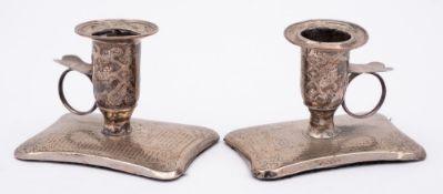 A pair of 19th century Russian silver chamber sticks, all marks rubbed,