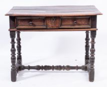 A 17th Century oak rectangular side table:, the top with a moulded edge,