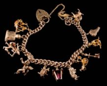 A 9ct gold curb-link bracelet: with thirteen various attached charms and heart-shaped padlock clasp,