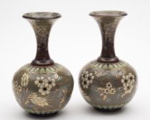 A pair of Doulton Lambeth Silicon-ware bottle vases by Edith Lupton: decorated with flower sprays,