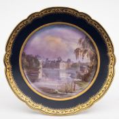 A French porcelain topographical plate: the centre painted with a view of the Chateau de