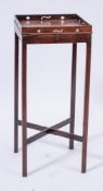 A George III mahogany square urn stand:, with a pierced geometric gallery,