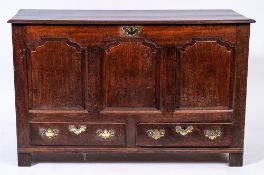 An 18th Century oak dower chest:, with a rectangular hinged top,