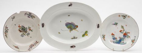 A Meissen oval deep dish of Schmetterling type and two similar plates: the deep dish painted with a