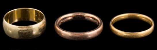 A 22ct gold band, a wide 18ct gold band and a 9ct gold band.