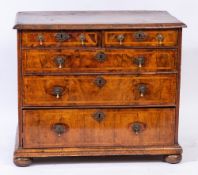 An early 18th Century walnut and feather banded rectangular chest:,