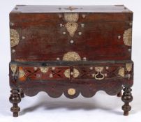 A 19th Century Dutch East Indies teak and brass mounted rectangular chest on an integral stand:,