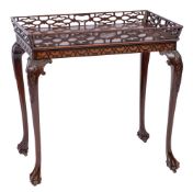 An Edwardian carved mahogany rectangular silver table:,