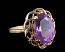 A 9ct gold and oval amethyst single-stone ring: within pierced setting, ring size P 1/2.