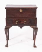 An 18th Century oak bible box on a stand:, with a rectangular moulded hinged top,