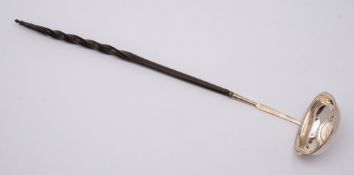 A Georgian silver toddy ladle, unmarked: with coin inset to the oval bowl,