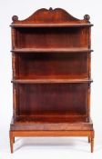 An early 19th Century mahogany four tier graduated open bookcase:,