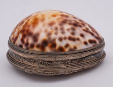 A late 18th/early 19th Century Continental silver mounted cowrie shell: the hinged lid with