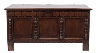 An 18th Century oak rectangular coffer:, with a plain hinged moulded top,