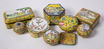 A group of eight Chinese Canton famille rose yellow-ground enamel boxes and covers and a miniature