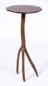 An unusual rustic occasional table:, the polygonal oak top on a sycamore branch base,