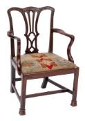 A George III mahogany elbow chair:, in the Chippendale taste,
