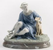 A French coloured parian figure of Diana: wearing lilac robes,seated on a green mound base,