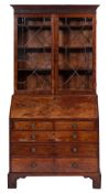 A George III mahogany bureau bookcase:,