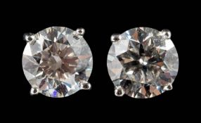 A pair of 18ct white gold and diamond single-stone ear studs: set with round brilliant-cut diamonds