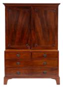 A George III mahogany linen press:, the upper part with a moulded cornice,