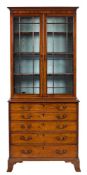 A George IV mahogany secretaire bookcase:, the upper part with a moulded cornice,
