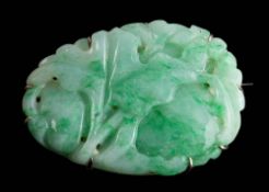 A carved jade panel brooch: approximately 40mm long x 29mm wide,