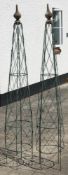 A pair of green painted iron conical sweet pea frames:, with turned wood pointed finials,